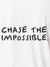 Close up of 'Chase The Impossible' design on Men's White Polo T-shirt, highlighting intricate details and vibrant print.