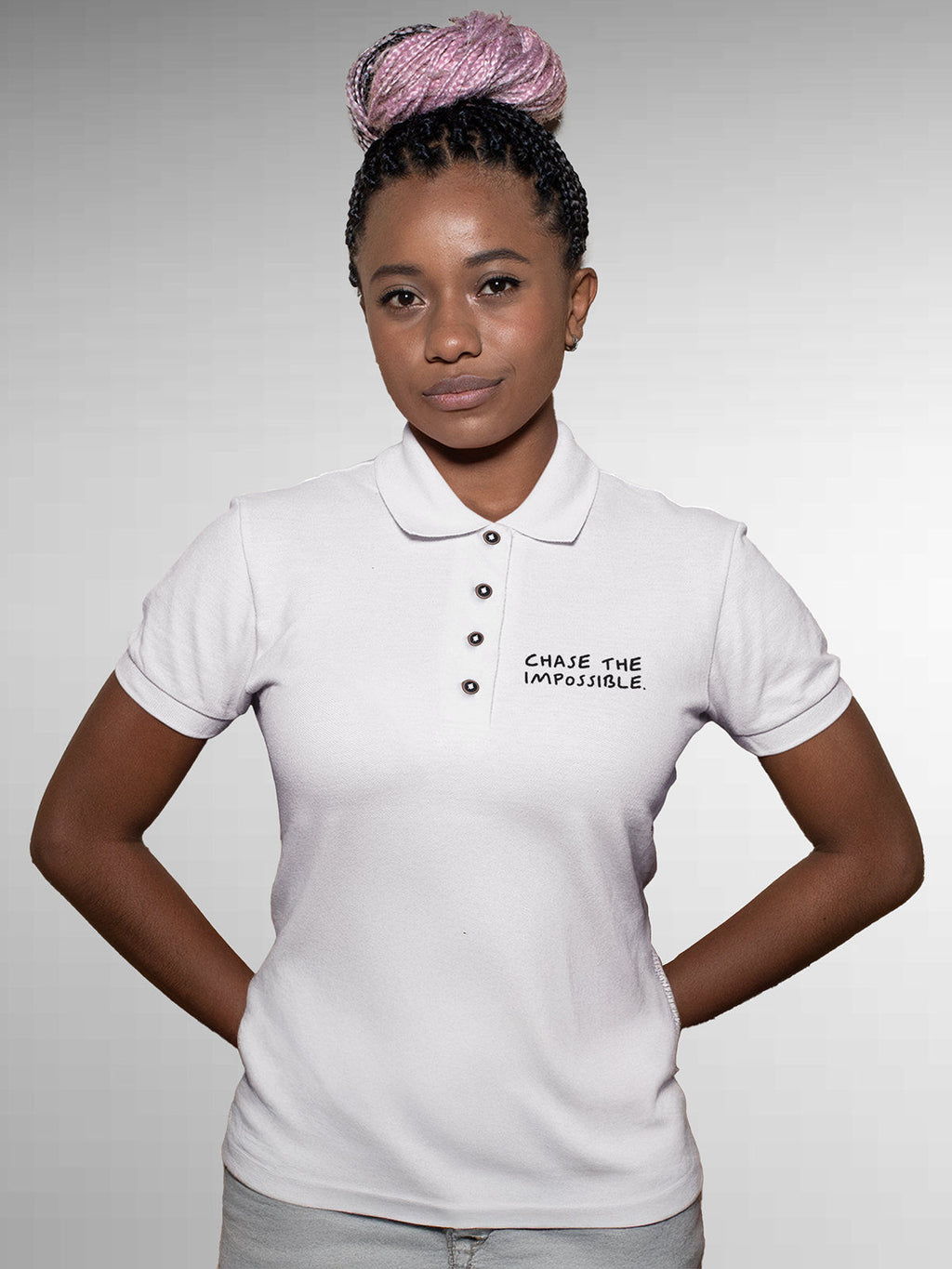Model wearing Women's White Polo T-shirt with 'Chase The Impossible' design, offering effortless style and premium comfort