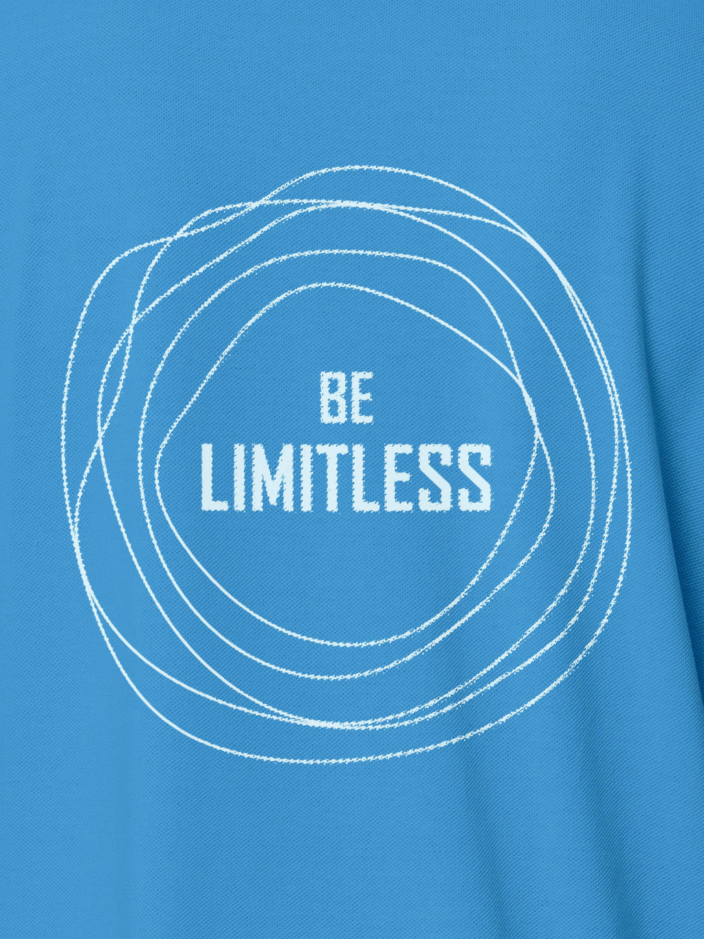 Close up of 'Be Limitless' design on Men's Blue Polo T-shirt, highlighting intricate details and vibrant print.