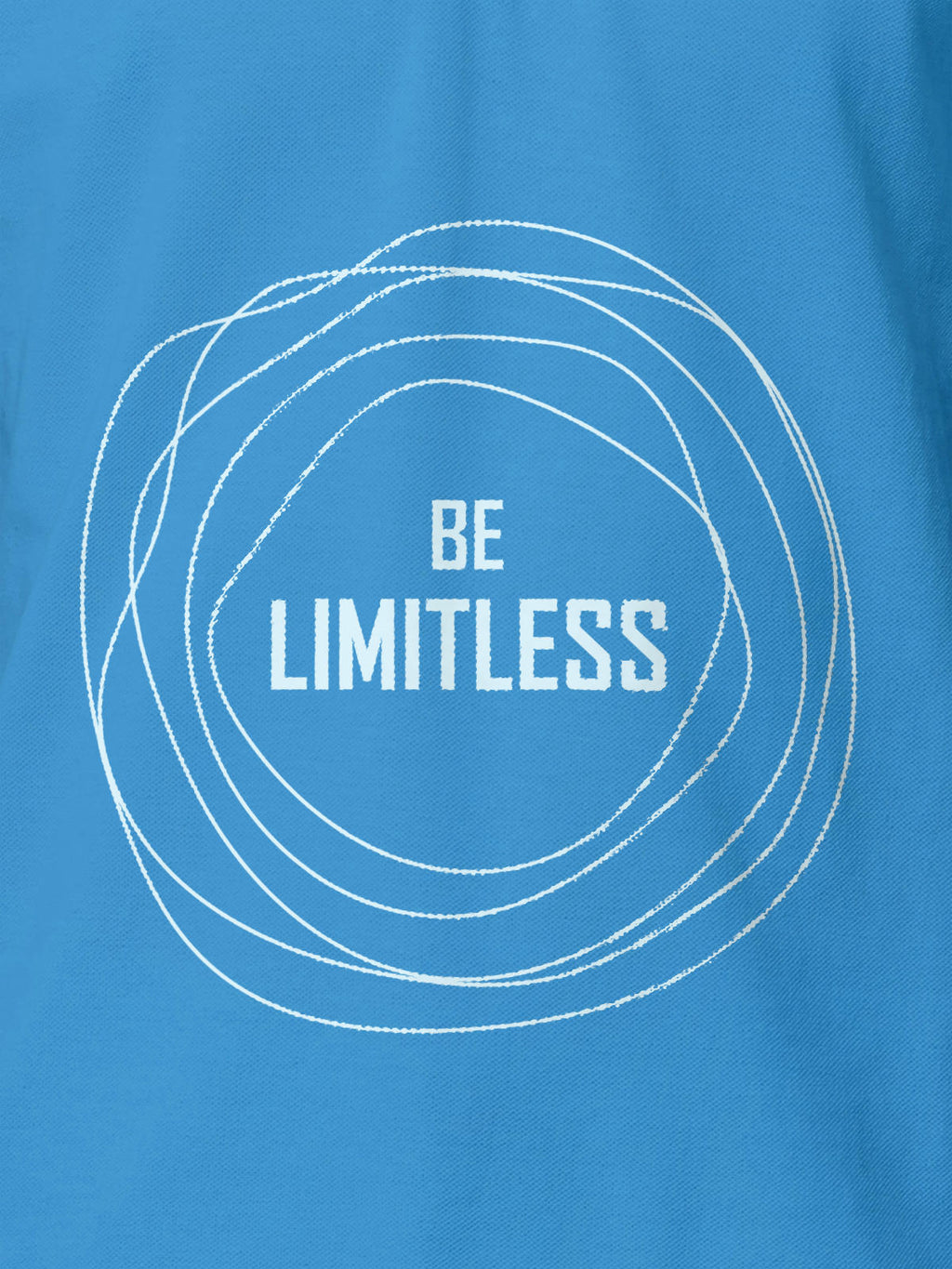 Close up of 'Be Limitless' design on Women's Blue Polo T-shirt, highlighting intricate details and vibrant print.