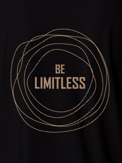 Close up of 'Be Limitless' design on Men's Black Polo T-shirt, highlighting intricate details and vibrant print.