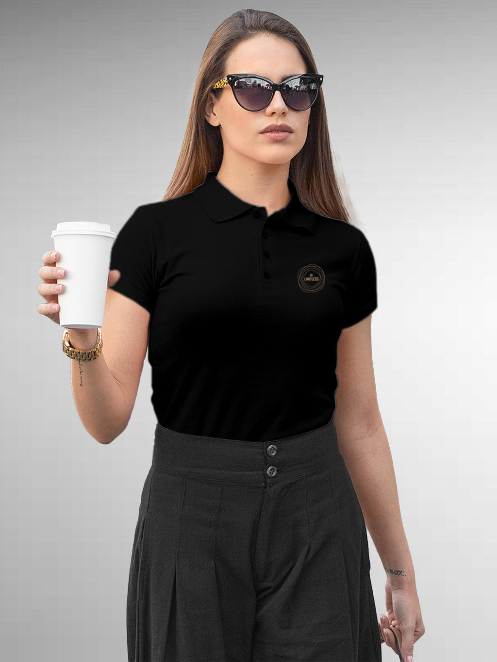 Model wearing Women's Black Polo T-shirt with 'Be Limitless' design, offering effortless style and premium comfort