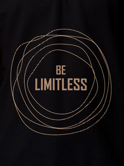 Close up of 'Be Limitless' design on Women's Black Polo T-shirt, highlighting intricate details and vibrant print.