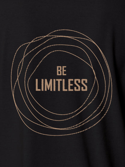 Close up of 'Be Limitless' design on Men's Dark Grey Polo T-shirt, highlighting intricate details and vibrant print.