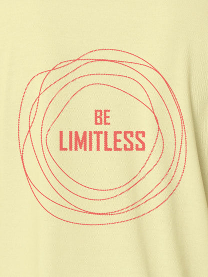 Close up of 'Be Limitless' design on Men's Yellow Polo T-shirt, highlighting intricate details and vibrant print.